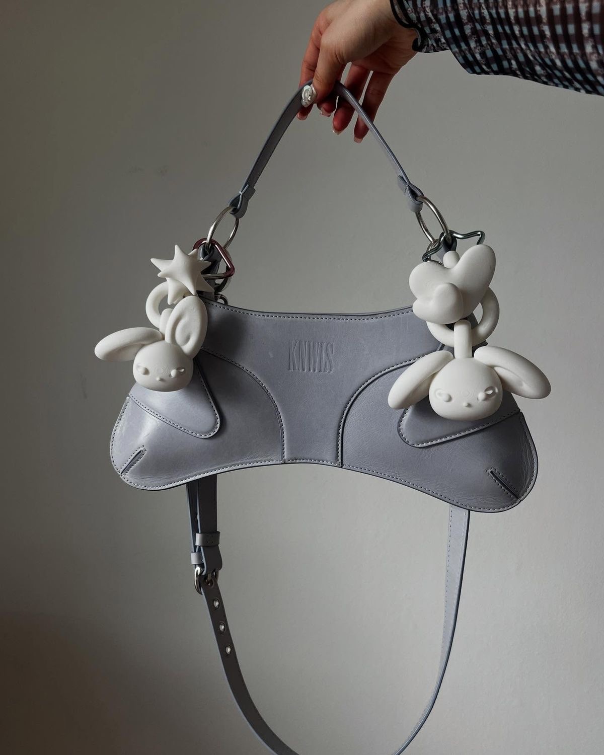 white keychains on purse